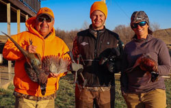 Don Dubuc, Chris LeCog, and Martha Spencer in South Dakota pheasant hunting
