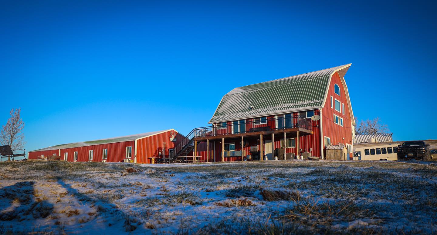 The sight of a large rustic barn and farm house welcome hunters to Bad River Bucks & Birds