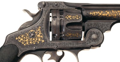 This close up of a gold inlaid Smith & Wesson .44 revolver shows exquisite detailing by master engraver Gustave Young. 